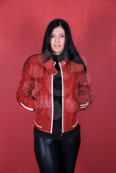Royalty Free Photo of a Woman Wearing a Red Jacket 
