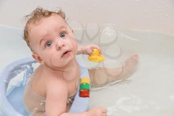 Royalty Free Photo of a Baby Boy Getting a Bath