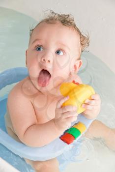 Royalty Free Photo of a Baby Getting a Bath