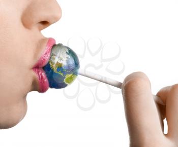 Royalty Free Photo of a Woman Kissing Lollipop as Earth