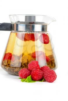 Royalty Free Photo of a Teapot Full of Fruit Tea and Berries