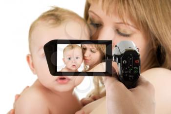Royalty Free Photo of a Mother and Baby Being Filmed