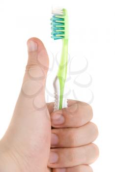 Royalty Free Photo of Someone Holding a Toothbrush