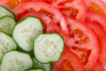 Royalty Free Photo of Cucumbers and Tomatoes