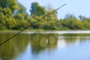 Royalty Free Photo of a Fishing Rod at a Lake