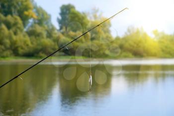 Royalty Free Photo of a Fishing Rod at a Lake