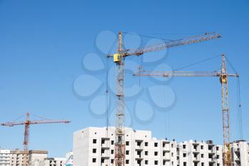 Royalty Free Photo of a Crane and Building Under Construction
