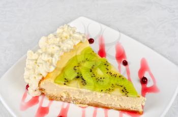 tasty kiwi fresh cake closeup at plate