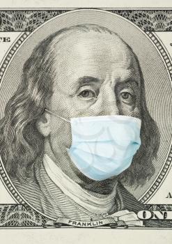 100 dollar banknote with medical mask. The concept of coronavrius epidemic