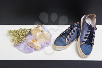 Set of shoes, soap and aroma bouquet of dried flowers