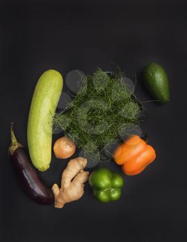 Fresh vegetables and micro greens sprouts on black background. Concept of superfood and healthy organic food