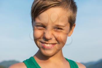 Closeup portrait of a boy in beauty summer day.