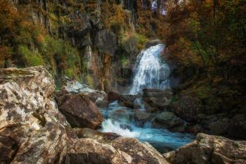 Korbu Waterfall at Lake Teletskoye in autumn Altai Mountains. The most famous lake waterfall