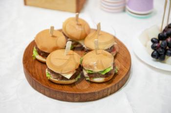 Catering service. TMini burgers on the table