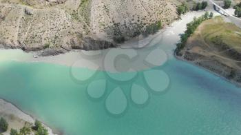 The confluence of two rivers, Katun and Chuya, the famous tourist spot in the Altai mountains, Siberia, Russia, aerial 4k footage.