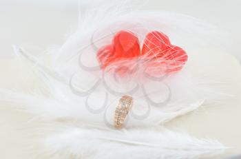 wedding rings and two hearts