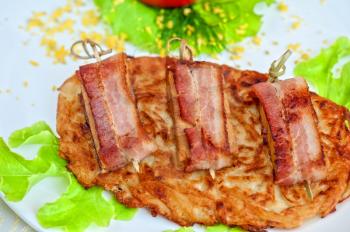 roast of veal meat with bacon with potatoes