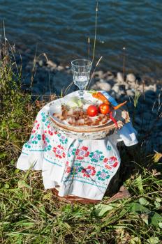Russian vodka in small glass with snacks at outdoors