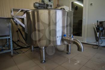 Cheese production at dairy farm, first stage - milk processing