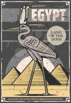 Egypt travel and ancient Egyptian culture tours poster. Vector Bennu god or heron bird deity and Egypt historic landmarks of Cheops and Tutankhamen pyramids in Cairo or Giza