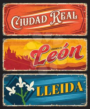 Ciudad Real, Leon and Lleida grunge plates. Spanish provinces regions tin signs with medieval architecture landmarks, coat of arms iris flower symbols and ornaments. Travel to Spain souvenir plate