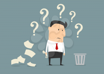 Perplexed confused businessman out of ideas standing alongside a pile of crumpled paper staring at a waste paper bin surrounded by question marks
