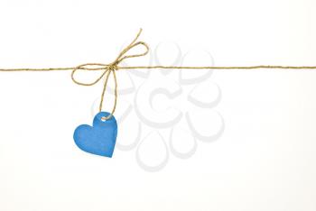 Royalty Free Photo of a Bow With Blue Tag Heart