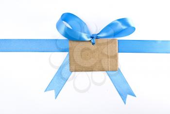 Royalty Free Photo of a Blank Cardboard Gift Tag and Ribbon