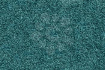 Close-up of Teal synthetic fibrous surface useful as background