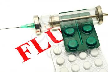 Swine FLU H1N1 disease alert - pills and syringe over white 