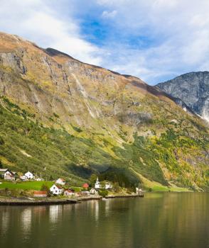 Life in Norway: fjord, mountains and village on the river bank