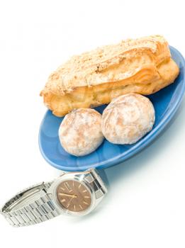 Lunch time - Watch and delicious pastry on white
