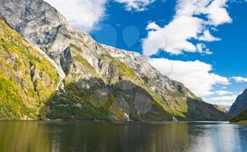Norwegian Fjord: Mountains and blue cloudy sky