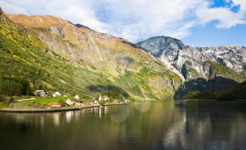 Scandinavian landscape: Fjord, mountains and village