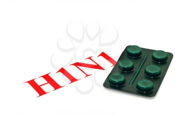 Swine FLU H1N1 alert - green pills on white