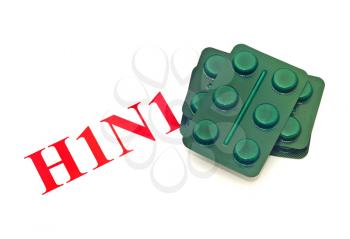 Swine FLU H1N1 - Closeup of green pills over white