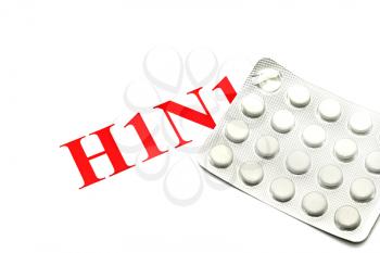 Swine FLU H1N1 - Closeup of green pills on white