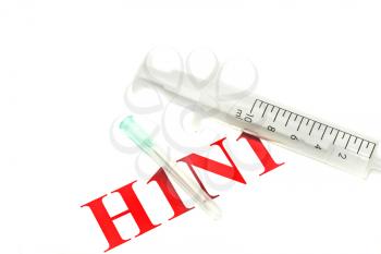Swine FLU H1N1 disease alert - tablets and syringe over white