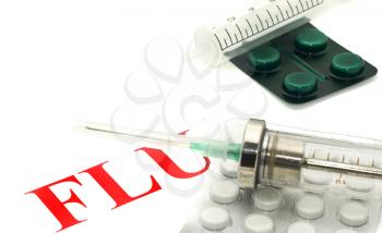 Swine FLU H1N1 disease alert - tablets and syringe over white