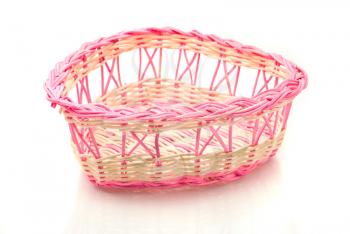 Valentines day - Pink woven basket for gifts over white background