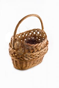 Beautiful Wicker woven basket over white background