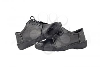 Black women's leather shoes over white background