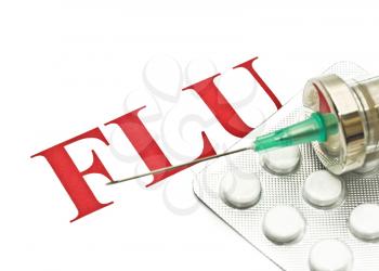 Swine FLU H1N1 - Closeup of pills and syringe over white