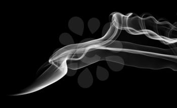 Abstract white smoke pattern and curves over black backgroun d