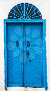 Blue wooden door with arch from Sidi Bou Said in Tunisia. Large resolution