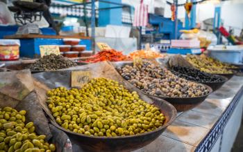 Olives on market counter in Eastern country like Tunisia, Egypt, Turkey