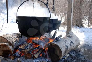 Royalty Free Photo of a Kettle and Open Fire
