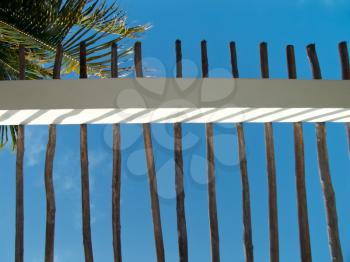 Fence agains the blue caribbean sky.