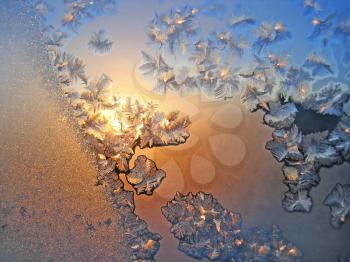 frost and sun on winter glass background