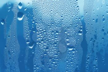 blue texture of water drops on glass